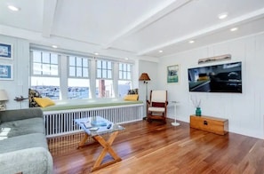 Take in harbor views by the bay window or unwind in front of the Smart TV
