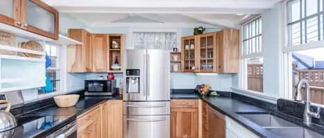 A fully equipped kitchen with all new stainless appliances