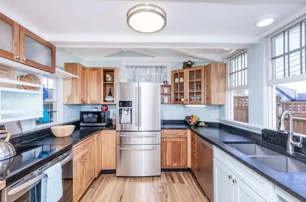 A fully equipped kitchen with all new stainless appliances