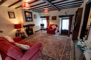 Downstairs sitting room opening into the courtyard or the garden on either sides