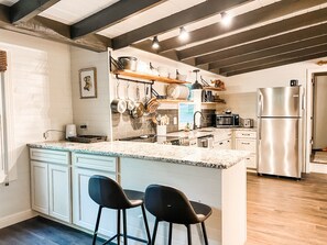 Fully stocked kitchen with stainless steel appliances