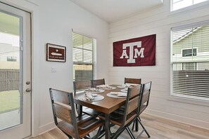 Enjoy breakfast on this modern industrial style table that seats 6.