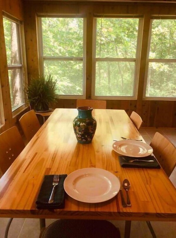 Amazing 180 view of the wooded valley from the sunroom.