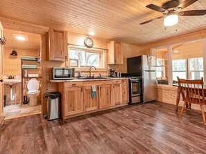 Other view of living area & sunroom.