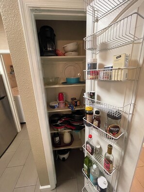 Fully equipped pantry in kitchen. 