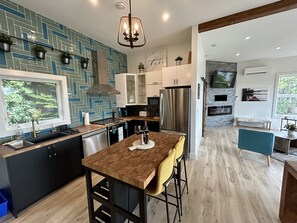 Full kitchen with fridge/freezer, stove, range hood, dishwasher & microwave.