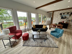Open concept living space with 10 foot ceilings throughout.