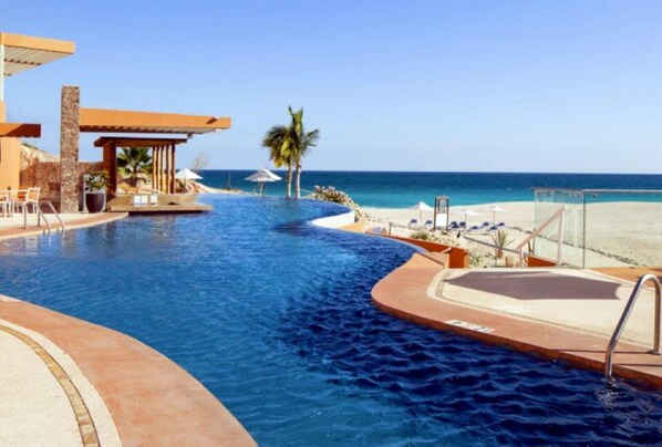 Lower beachside pool with swim up bar