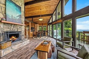 Living area includes deck access & dining area.