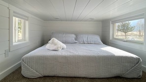Bedroom 1 features a king bed with a comfortable mattress and soft linens.