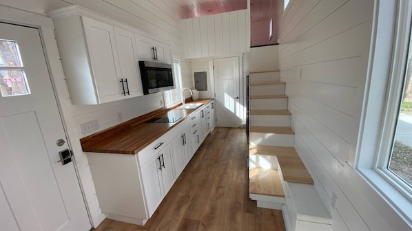 Bright, airy, and effortlessly chic—equipped with a microwave and stove.