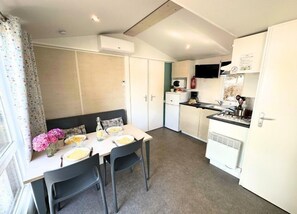 Bright dining area with plenty of natural light, perfect for enjoying meals together.