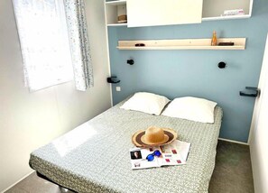 Cozy bedroom with soft lighting and warm touches, ideal for a restful night.