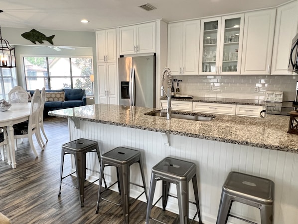 Our updated kitchen has bar seating for 4 people.