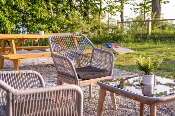 Outdoor dining area, living area, and hot tub