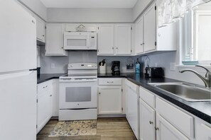 This Galley Kitchen has everything you need to make Delicious Meals while on Vacation.