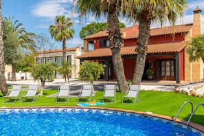 Surrounded by lush greenery with a central swimming pool in your private oasis is an experience in its own kind