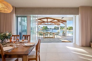 The home features stacking doors for an indoor, outdoor flow