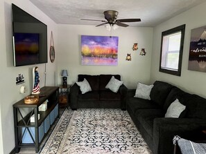 Living room with smart TV and Queen Sleeper Sofa