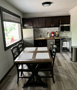 Dining area and fully stocked kitchen