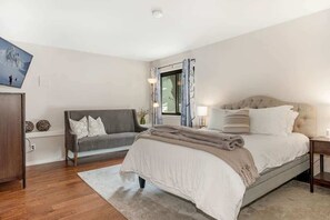 Primary bedroom suite with queen bed
