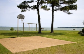 Basketball court in front yard
