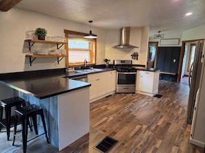 Fully stocked kitchen with bar area