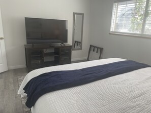 Another view of Bedroom 1 with 55" Smart TV