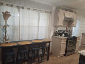 Eating area for 7 plus outdoor dining off kitchen that seats 4 