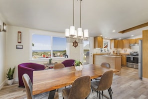 Dining room open to kitchen. High-quality live edge table with seating for 6 