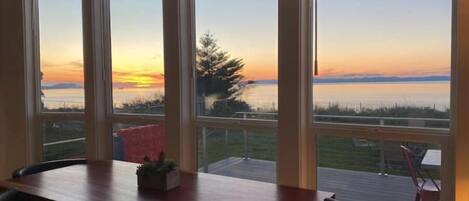 The property enjoys amazing sunsets. Custom handmade Padauk live-edge table