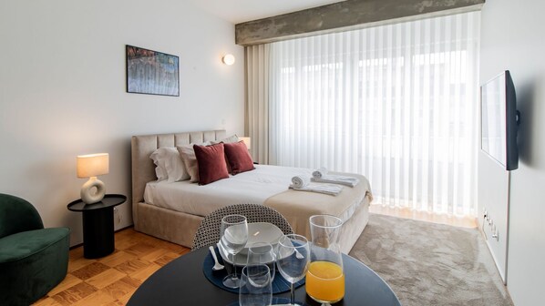 Main modern area with a double bed and TV #modern #stylish #airbnb