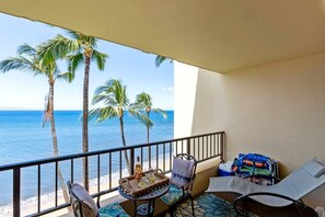 Lanai features your beach gear and table for two, sun lounger, and egg swing.