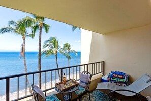 Lanai features your beach gear and table for two, sun lounger, and egg swing.