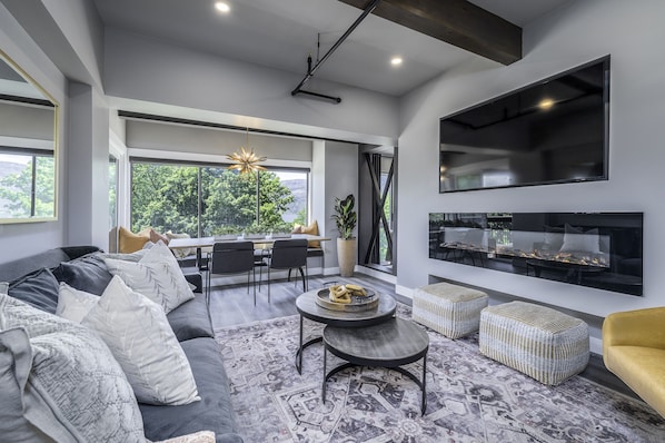Comfortable living room anchoring two king suites on opposite sides of condo