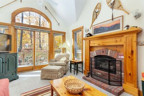 Gorgeous, airy great room with cozy gas fire.