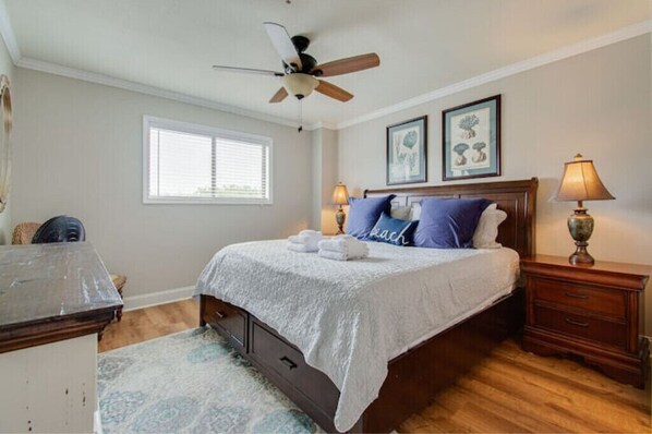 Spacious master bedroom with a king sized bed. 