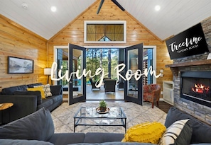 Gather around the warmth of the fire in a living room that's both spacious and intimate.