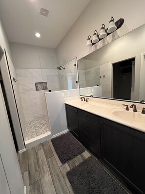 King bedroom bathroom with extra large shower and dual sinks 