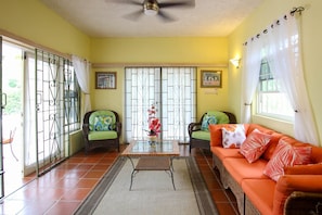 The living area opens right onto the patio and pool deck
