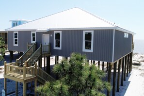 view from street. Home is located in the gulf front gated community- Audubon