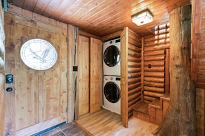 Washer & dryer for guest use beside the front door