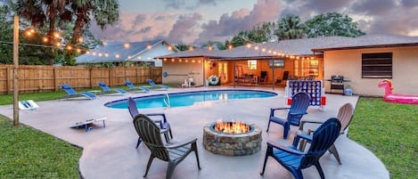 Backyard with fire pit, grill, corn hole, giant connect 4, giant jenga, pool floats & toys. 
And so much more!