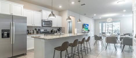Ultra Modern Kitchen Features Granite Counter Tops, Stainless Steel Appliances and Much More