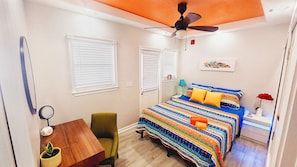Comfortable and colorful bedroom with queen size bed.