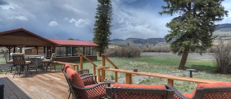 Riverfront Deck with Outdoor Dining and Lounge Chairs