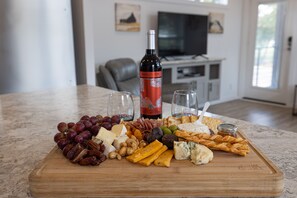 The carefully curated charcuterie board paired with a fine wine creates a perfect symphony of flavors and textures for a delightful evening.