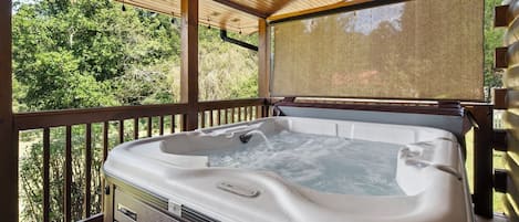 5 person hot tub with roller shades on both sides of the deck for extra privacy