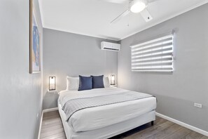 Bedroom 2 boasts a luxurious king-size bed for your ultimate comfort.