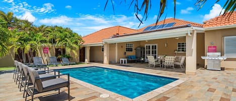 Cool off in our serene swimming pool, then lounge in comfort by the water's edge.